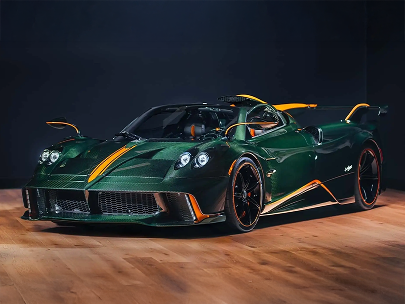 باجاني هوايرا 70 تريونفو 2026 – تصميم خارجي حصري من ألياف الكربون احتفالاً بعيد ميلاد هوراشيو باجاني السبعين الواجهة الأمامية لسيارة باجاني هوايرا 70 تريونفو مع مصابيح مزدوجة وتصميم مستوحى من Codalunga الجهة الخلفية لسيارة باجاني هوايرا 70 تريونفو مع جناح هوائي متطرف وديناميكا هوائية عالية الأداء تفاصيل ألياف الكربون المكشوفة في باجاني هوايرا 70 تريونفو بألوان خضراء وبرتقالية فريدة محرك V12 مزدوج التوربو من Mercedes-AMG بقوة 834 حصاناً في باجاني هوايرا 70 تريونفو ناقل الحركة اليدوي بسبع سرعات في باجاني هوايرا 70 تريونفو لعشاق القيادة الخالصة 2026 Pagani Huayra 70 Triumph – Exclusive Carbon Fiber Exterior Design Celebrating Horacio Pagani's 70th Birthday The Pagani Huayra 70 Triumph's front fascia features dual headlights and a design inspired by the Codalunga. The Pagani Huayra 70 Triumph's rear end boasts an extreme wing and high-performance aerodynamics. Exposed carbon fiber details in the Pagani Huayra 70 Triumph are available in unique green and orange colors. The Pagani Huayra 70 Triumph is powered by an 834 hp Mercedes-AMG twin-turbo V12 engine. The Pagani Huayra 70 Triumph features a seven-speed manual transmission for pure driving enthusiasts.