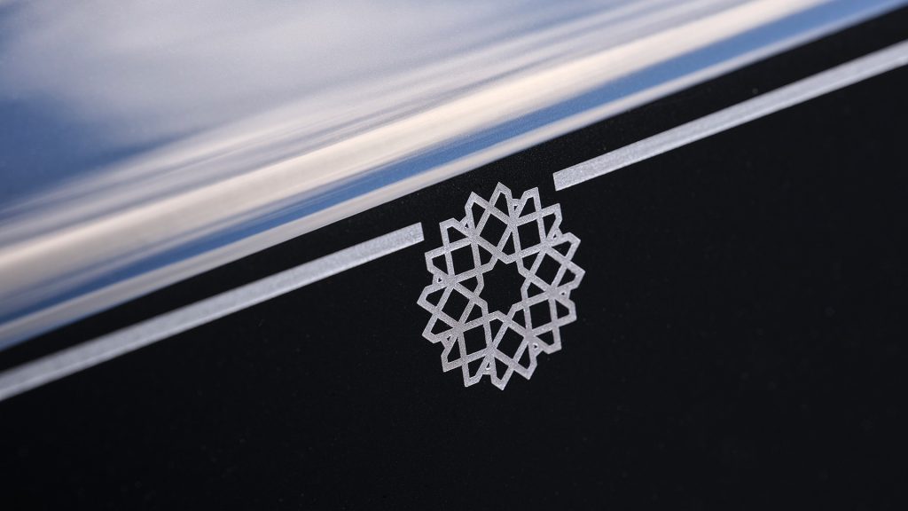رولز رويس فانتوم أرابيسك

Rolls Royce Phantom Arabesque

سيارات رولز رويس الشرق الأوسط

رولز رويس بيسبوك

سيارات فاخرة حصرية

luxury bespoke Rolls Royce

laser engraved hood Rolls Royce

Middle East inspired luxury cars

Rolls Royce Phantom Middle East

ultra luxury bespoke cars

رولز-رويس فانتوم أرابيسك 2026 بغطاء محرّك منقوش بالليزر مستوحى من المشربية

Rolls-Royce Phantom Arabesque 2026 laser-engraved hood inspired by Mashrabiya design

تصميم خارجي ثنائي اللون لسيارة رولز-رويس فانتوم أرابيسك الفاخرة

Two-tone exterior design of Rolls-Royce Phantom Arabesque luxury sedan

تفاصيل شبكة بانثيون المضيئة وتمثال روح السعادة في فانتوم أرابيسك

Illuminated Pantheon grille and Spirit of Ecstasy on Rolls-Royce Phantom Arabesque

غاليري المقصورة مع تطعيمات خشبية مستوحاة من العمارة العربية

Bespoke dashboard gallery with Mashrabiya-inspired wood inlays inside Phantom Arabesque

مقصورة رولز-رويس فانتوم أرابيسك مع تطريزات هندسية مستوحاة من المشربية

Rolls-Royce Phantom Arabesque interior with Mashrabiya-inspired embroidery

تفاصيل نقش الليزر الحصري على غطاء المحرّك في رولز-رويس فانتوم أرابيسك

Close-up laser engraving detail on Rolls-Royce Phantom Arabesque hood